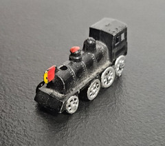 STEAM ENGINE LOCOMOTIVE, TRAIN. DIE CAST METAL, BLACK PAINTED. MARKED JAPAN