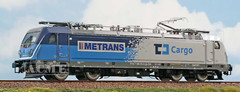 Acme 60692 TRAXX Class 388 015 in livery “ČD Cargo – METRANS” with white stripe.