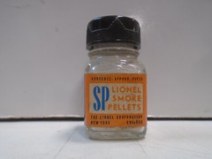 VINTAGE LIONEL #SP GLASS BOTTLE WITH 24 SMOKE PELLETS FOR OLDER LIONEL STEAMERS