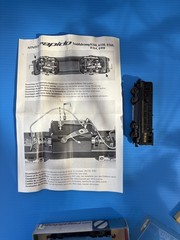Rapido N-scale locomotive plus 3 cars.