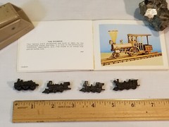 4 METAL LOCOMOTIVE MODELS and (unrelated) BOOKLET showing wood locomotive models