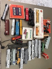 Various model trains-and accessories. (Tracks, Railroad crossing sign)