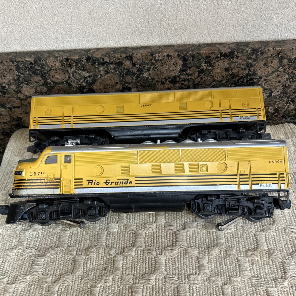 Lionel 2379 Rio Grande Diesel plus a car